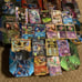 11 Pokémon tins with great cards, Pokémon sleeves, giant cards and more!!!! READ