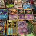 11 Pokémon tins with great cards, Pokémon sleeves, giant cards and more!!!! READ