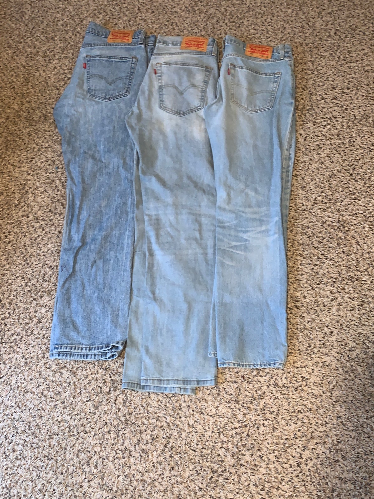 Three Levi Strauss jeans