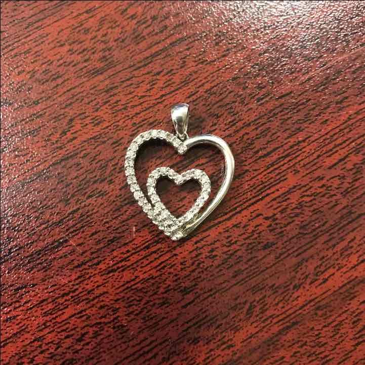 Sterling silver and diamond pendant.