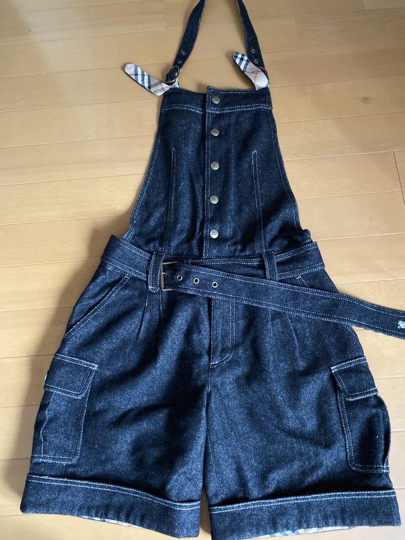 Dark denim overalls with a checked strap, Burberry.