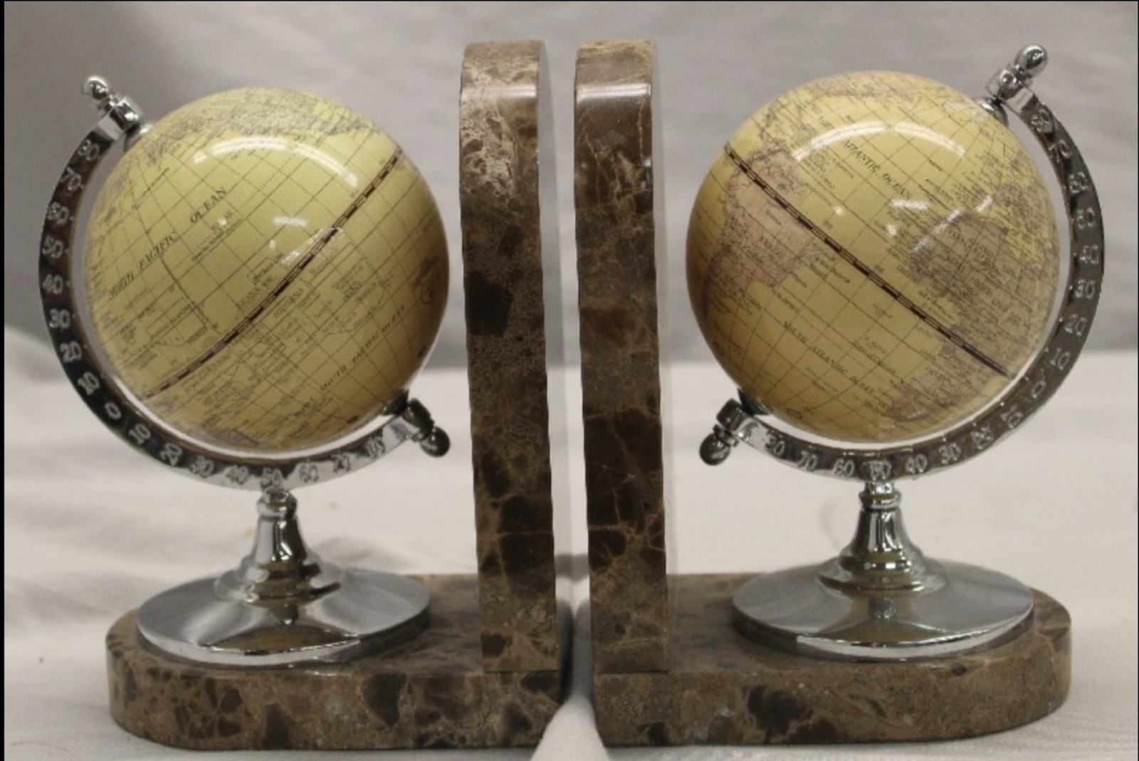 Vintage of Marble Globe book ends. Book ends are approx: 7 tall