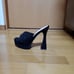 Black suede mules, size 39.