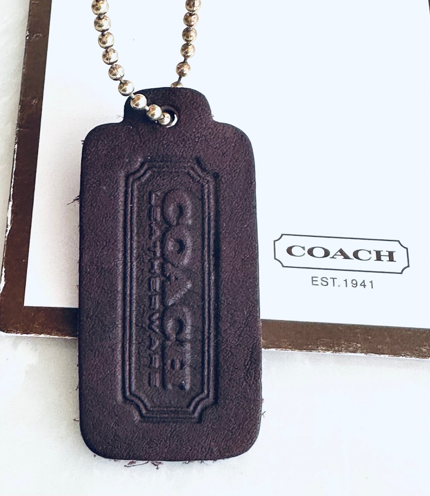 Coach vintage mahogany purple one-sided hangtag