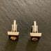 Vintage Anson Rotary International Silver Tone Cufflinks on Burgundy Background