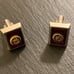 Vintage Anson Rotary International Silver Tone Cufflinks on Burgundy Background