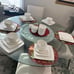 Elevate your dining experience with the Gibson Home Everyday Square White Cerami