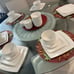 Elevate your dining experience with the Gibson Home Everyday Square White Cerami