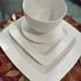 Elevate your dining experience with the Gibson Home Everyday Square White Cerami