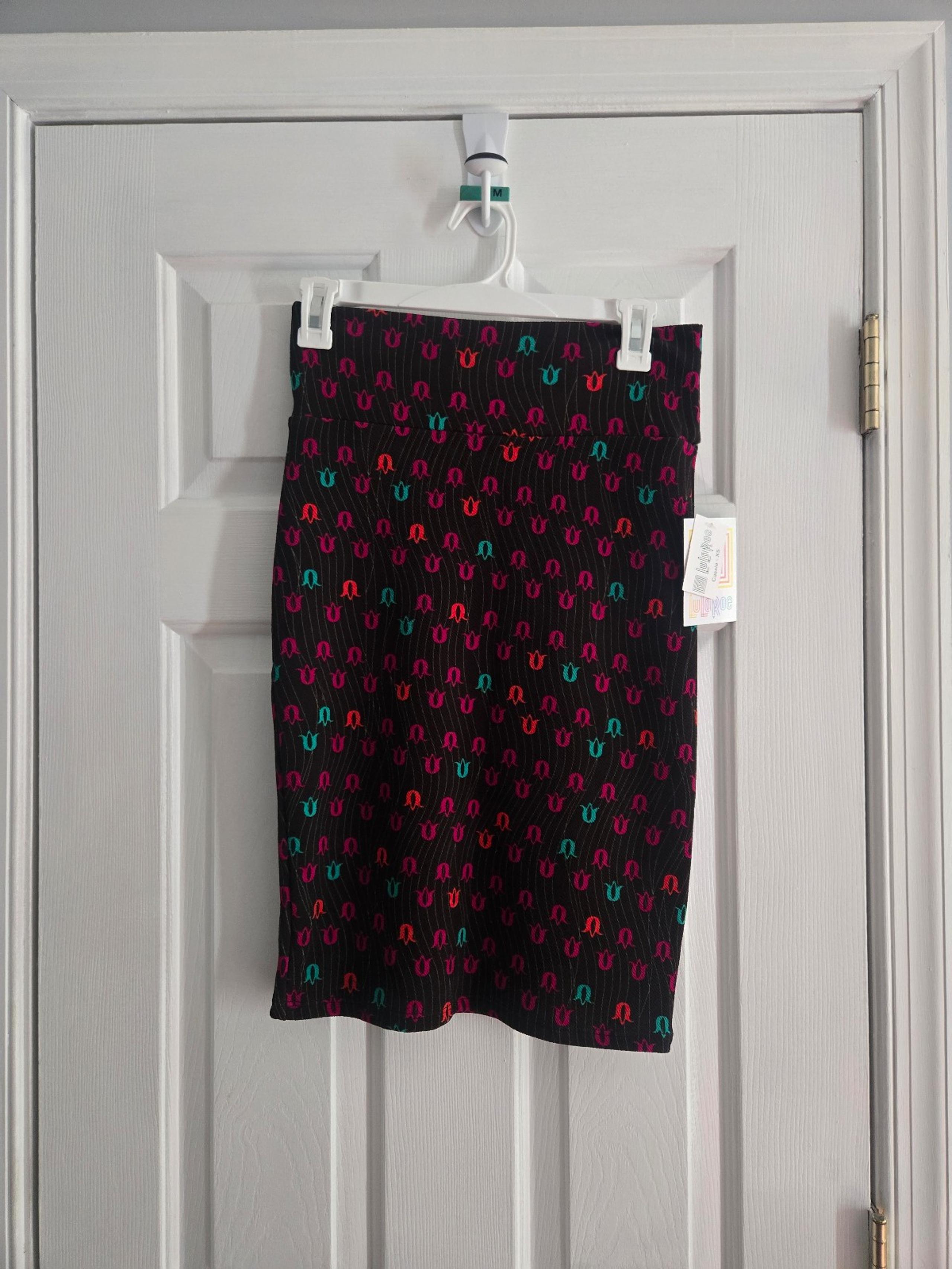 Stylish Black Cassie Skirt with Red and Green Accents