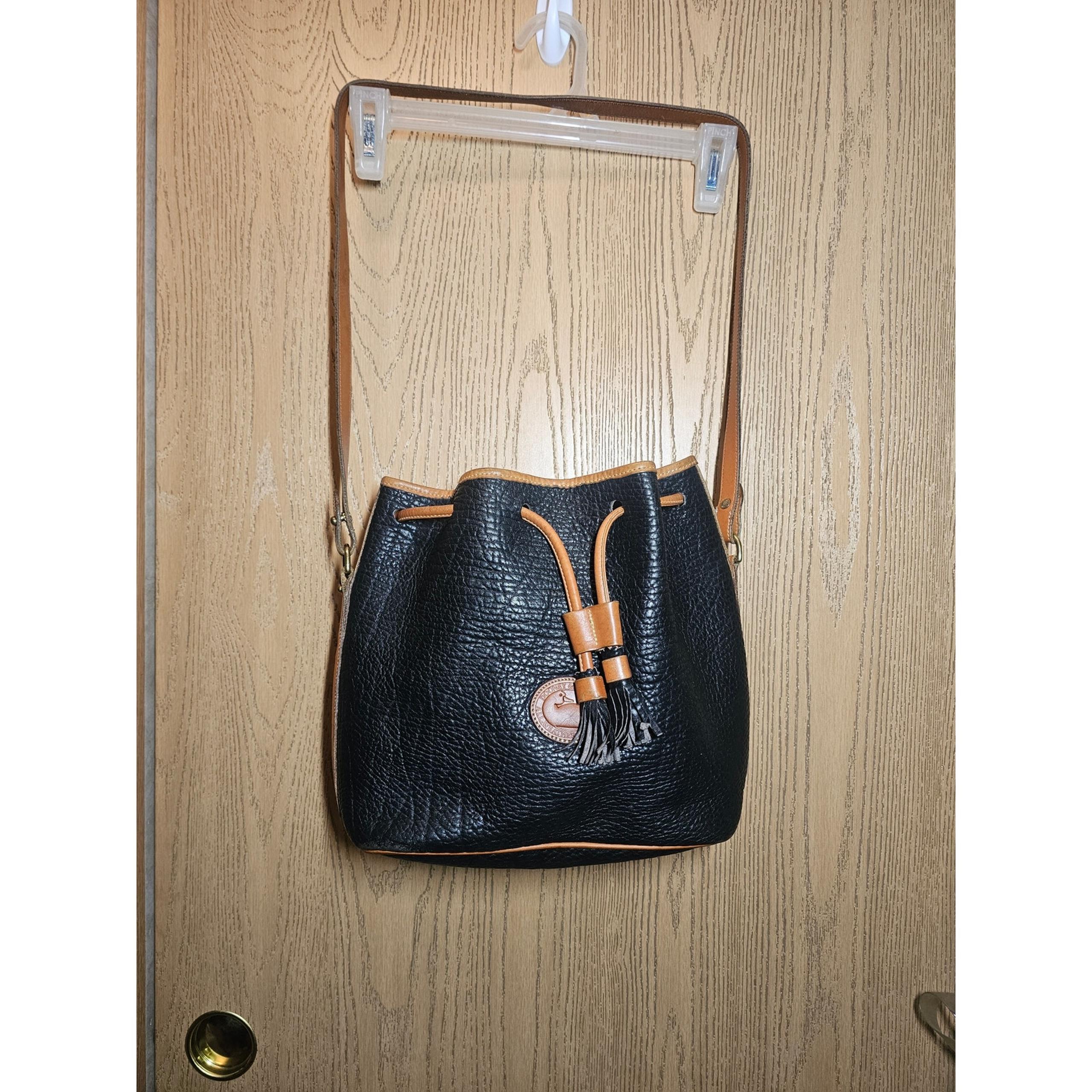 Vintage black and brown Dooney and Bourke bucket style bag. Gently used