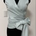 A light blue top by Nina Ricci.
