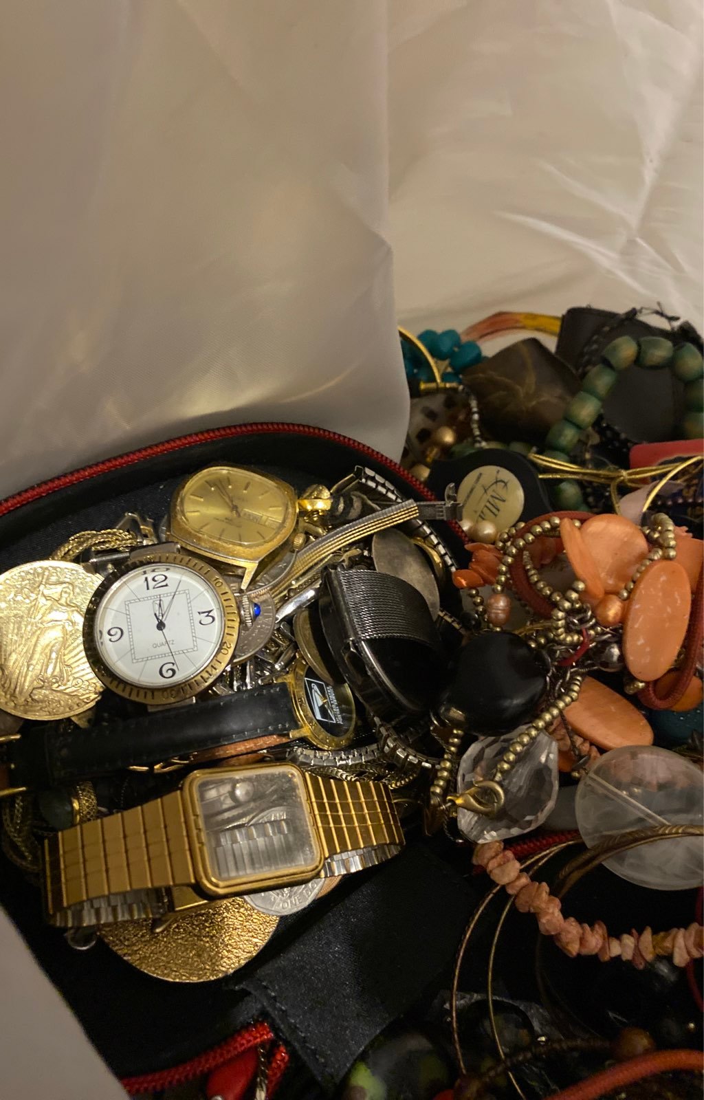 A bag slap full of jewelry costume all the way to 24 karat gold necklaces and ri
