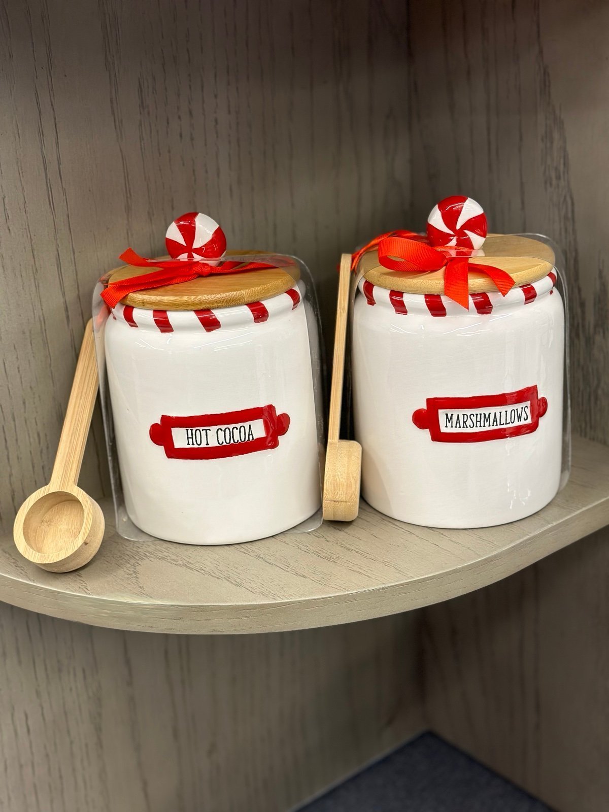 Hot cocoa and marshmallow canisters cellars topped with peppermint wooden lid