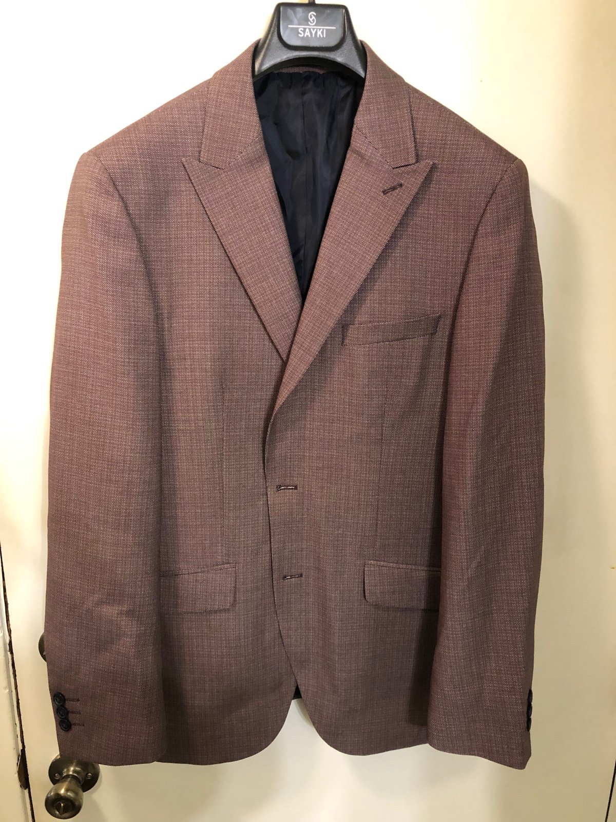 Brick red sports coat.