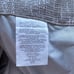 Four panels of tan blackout curtains 50x63”