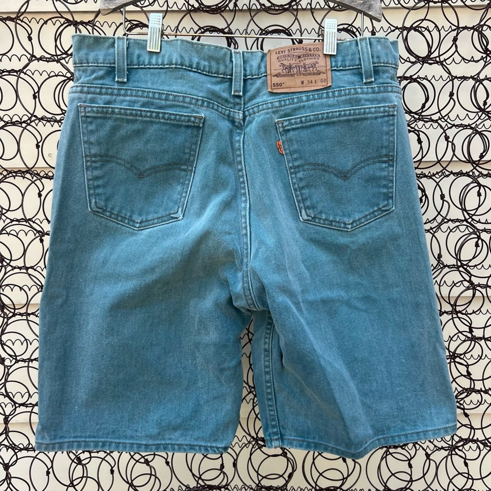 Vintage Levi’s 550 gray green orange tab jean shorts Size 34