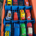 The Dukes of Hazzard carrying case and 13 ERTL cars