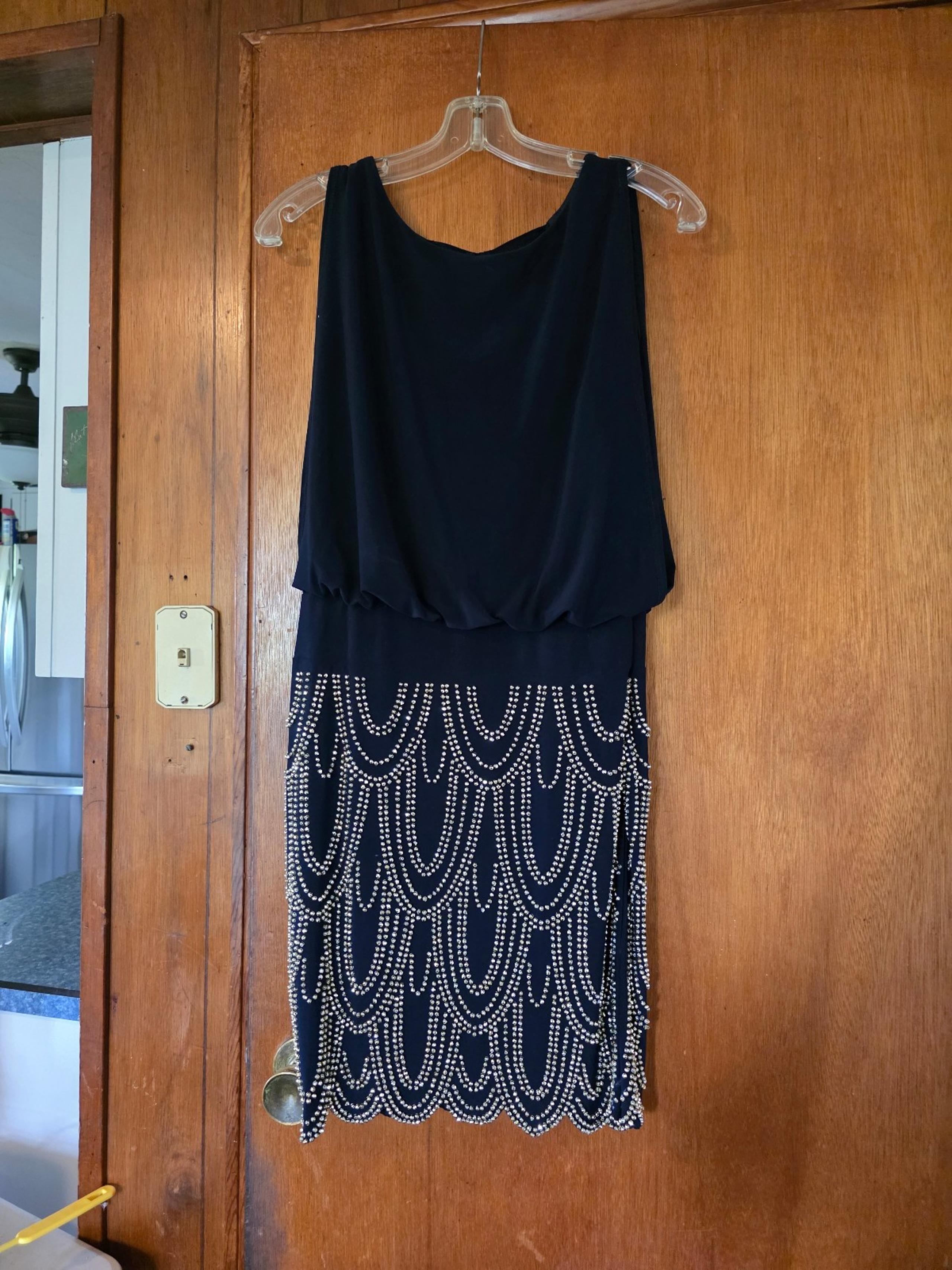 Dress looks like 1920 dress. Black with beaded skirt  dressy dress