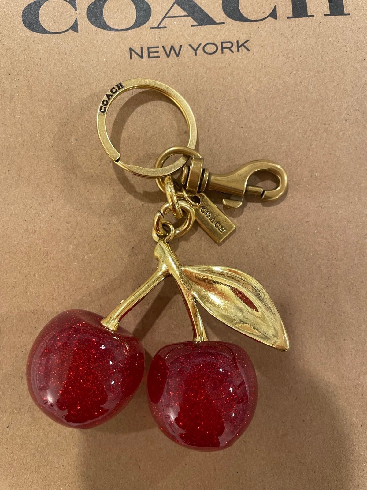 Coach cherry charm keychain