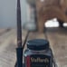 Antique fountain/dip pen, stand, and Stafford ink bottle.