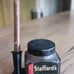 Antique fountain/dip pen, stand, and Stafford ink bottle.