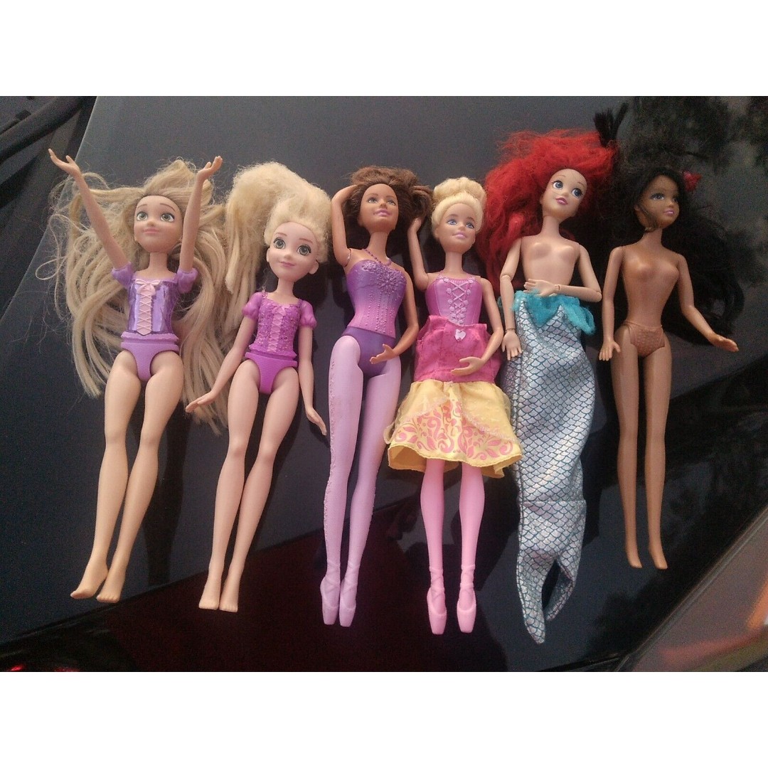 Lot Of 7 Barbie dolls and Disney Dolls