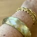 VINTAGE LEMONY YELLOW FACETED CHUNKY CELLULOID PLASTIC LUCITE BANGLE BRACELET