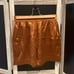 Reformation High-Waist Gold Silk Shorts