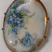 A antique porcelain hand-painted brooch