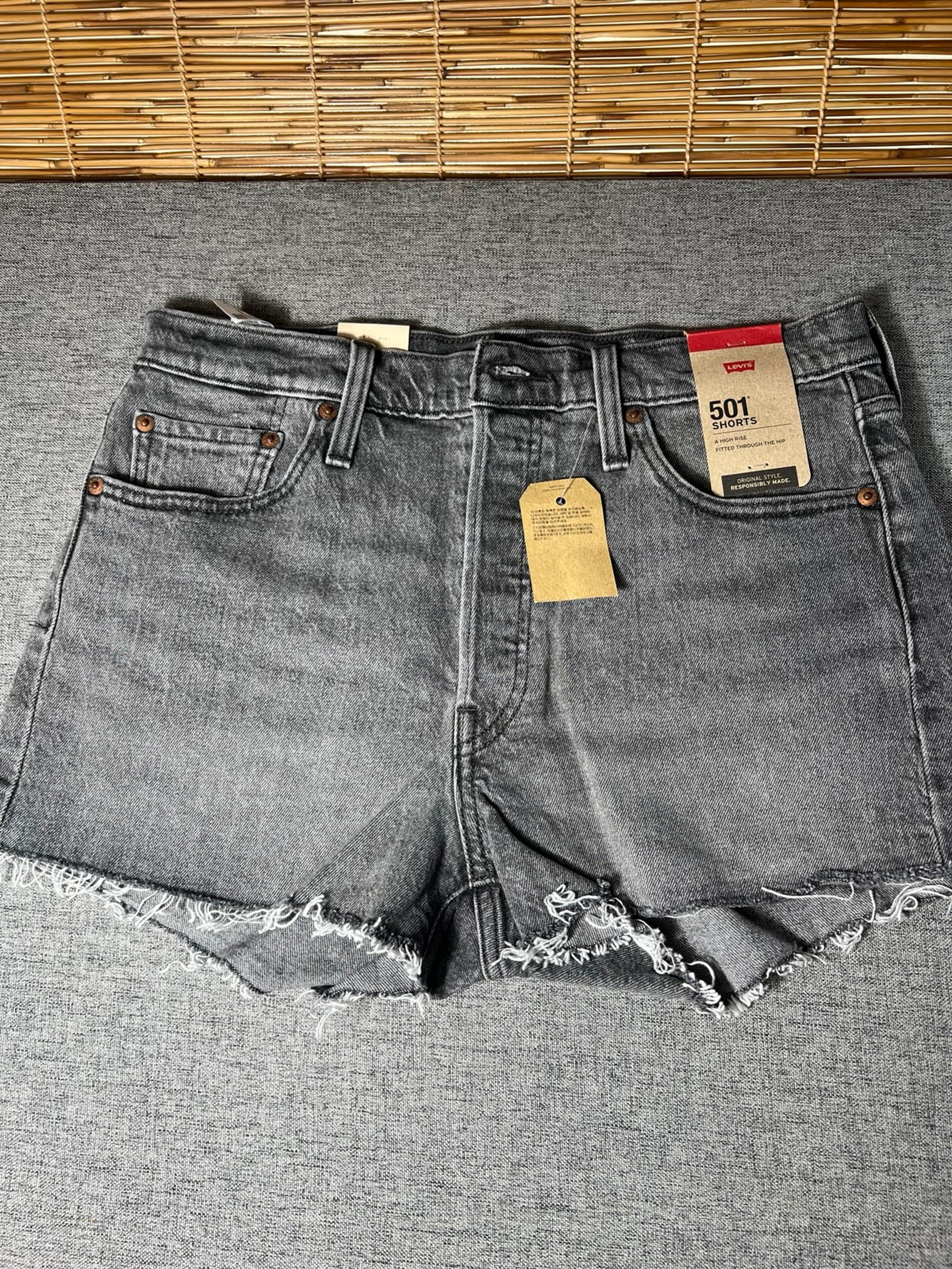 woman's Levi's Black Jean Shorts High-Waisted Raw size 29” ..