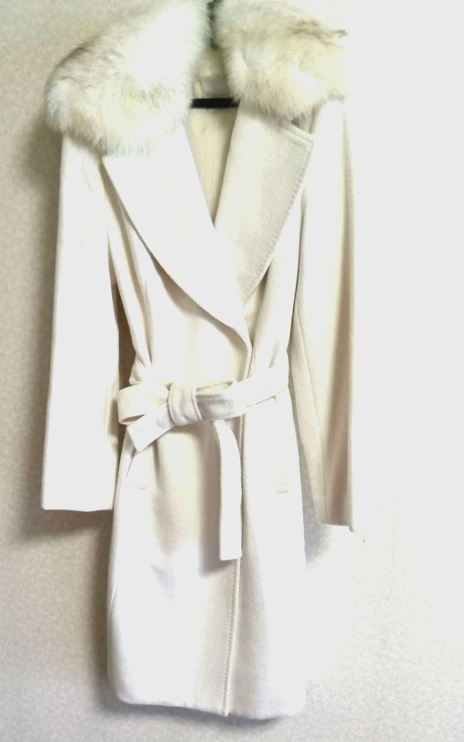 Brand new and unused! White wool and angora blend half coat with blue fox collar.