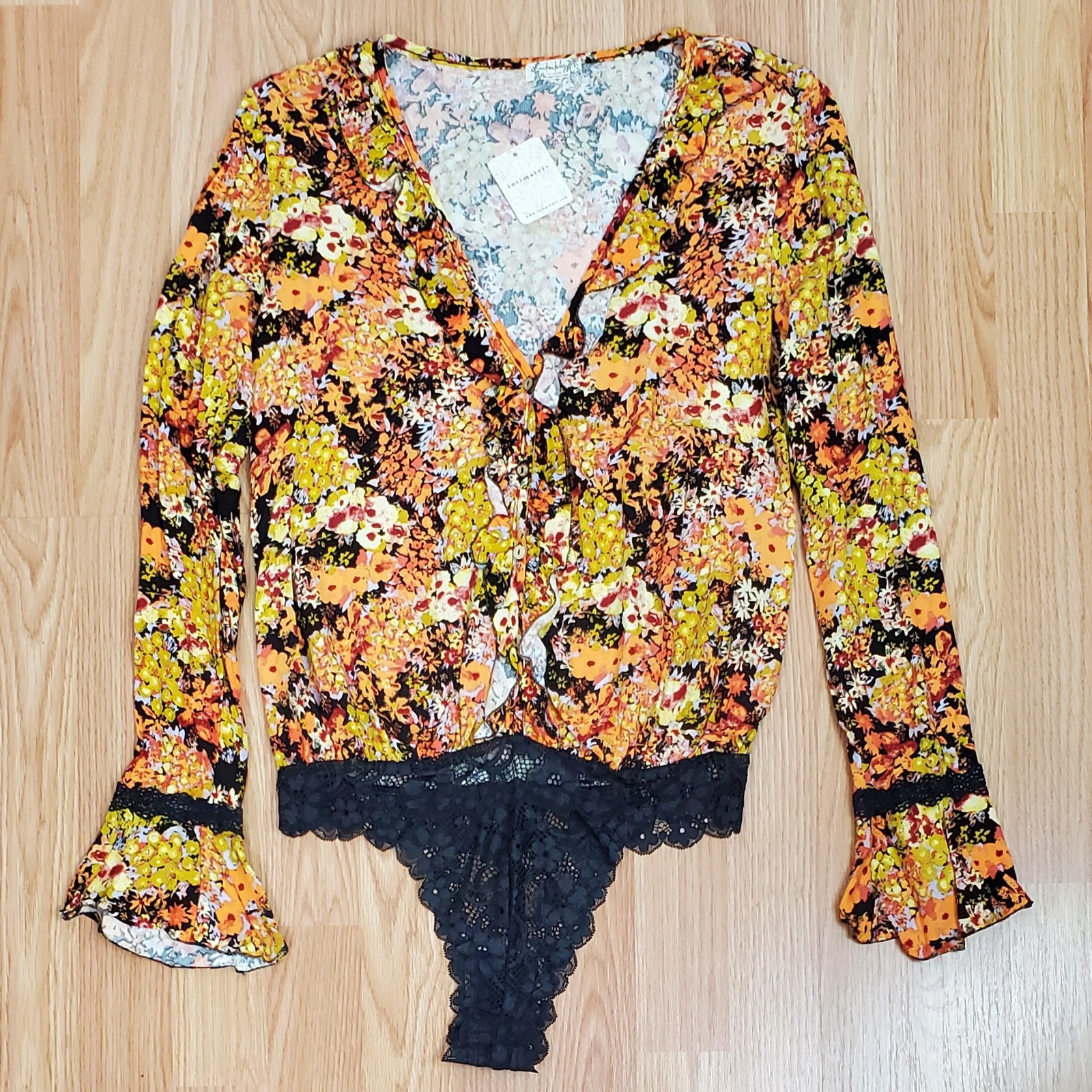 NWT Free people heat wave bodysuit midnight combo floral long bell sleeve v neck
