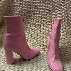 Pink Steve Madden boots with heel.