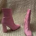 Pink Steve Madden boots with heel.