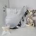 Silver messenger bag with strap