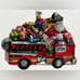 Santa Riding a Fire Truck full of Christmas Gifts Glass Ornament Neiman Marcus