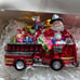Santa Riding a Fire Truck full of Christmas Gifts Glass Ornament Neiman Marcus
