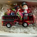 Santa Riding a Fire Truck full of Christmas Gifts Glass Ornament Neiman Marcus