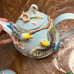 Pier 1 hand painted 3D porcelain teapot with accessories