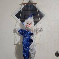 Vintage clown on swing