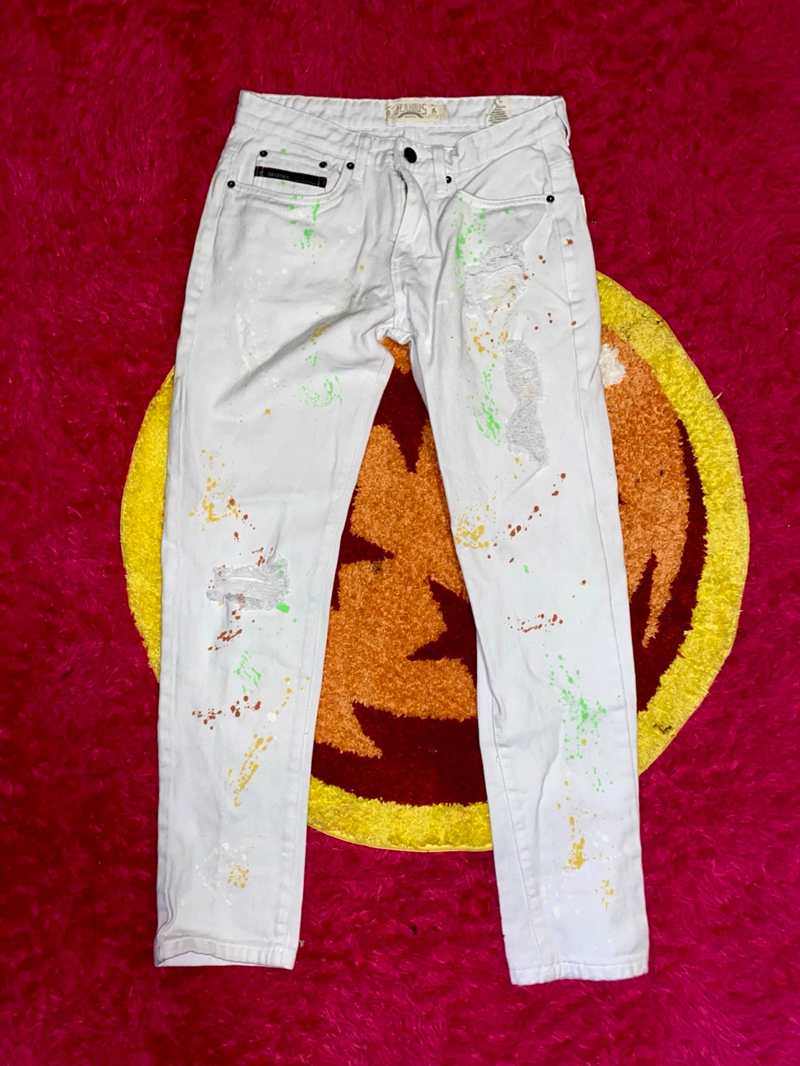 Akademiks men’s distressed paint splatter jeans