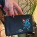 Authentic COACH pebbled leather zip top wristlet Wonder Woman