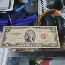 Red ink 2 dollar bill