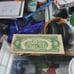 Red ink 2 dollar bill