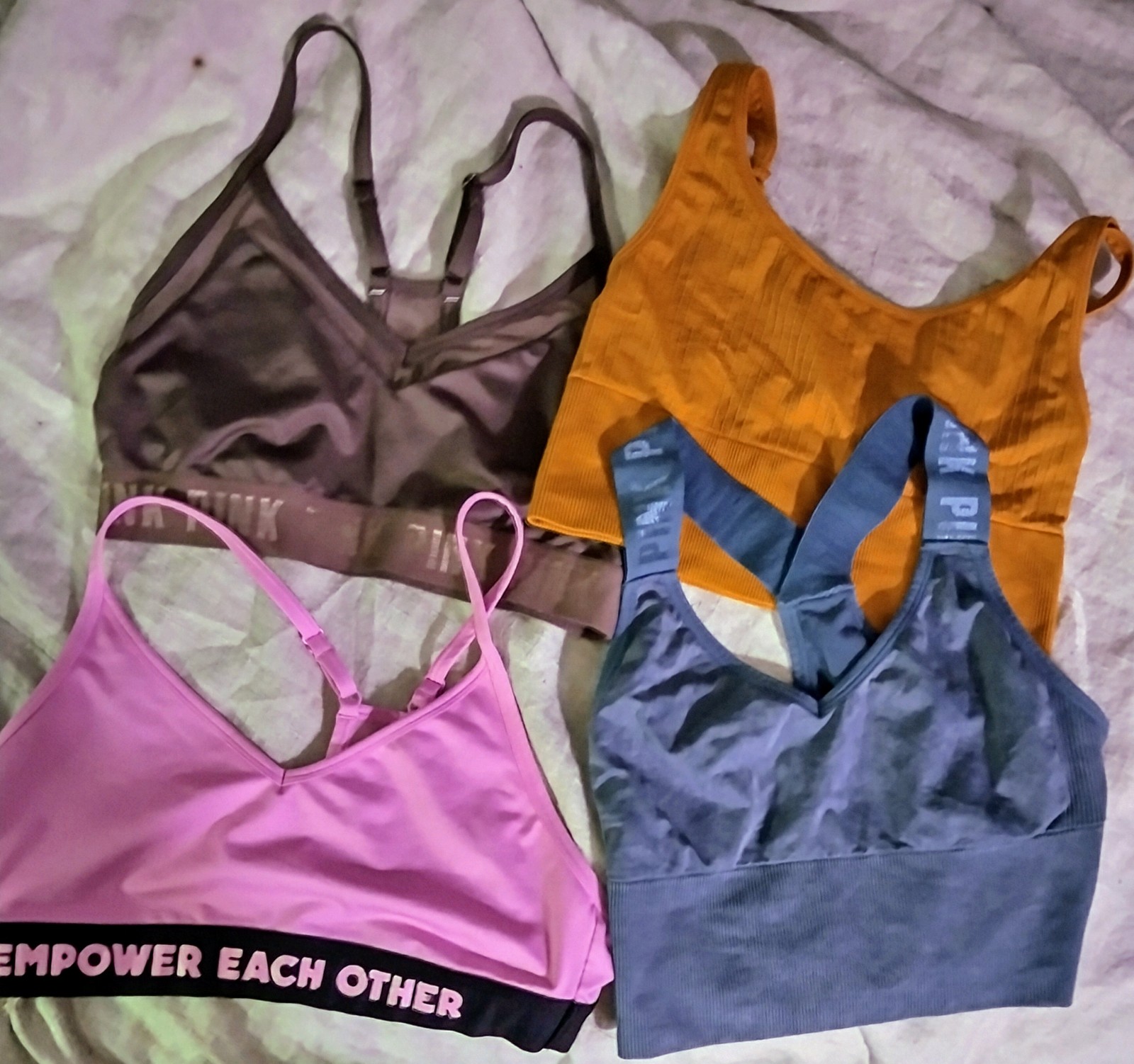 Lot of Victoria's Secret Workout Outfits. 4 Sports bras & 2 pairs of leggings.