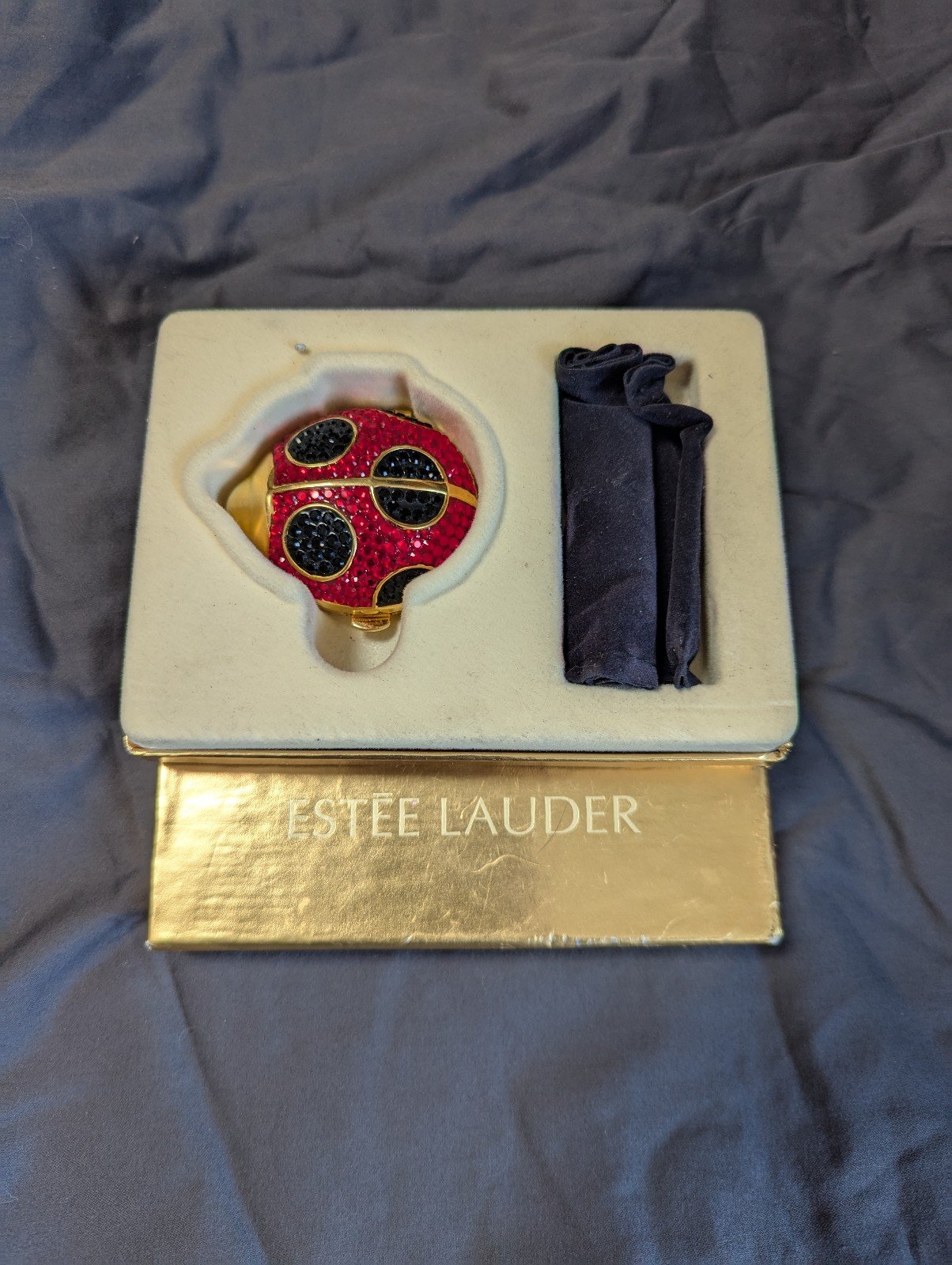 Vintage Estee Lauder ladybug powder compacts red and black crystals