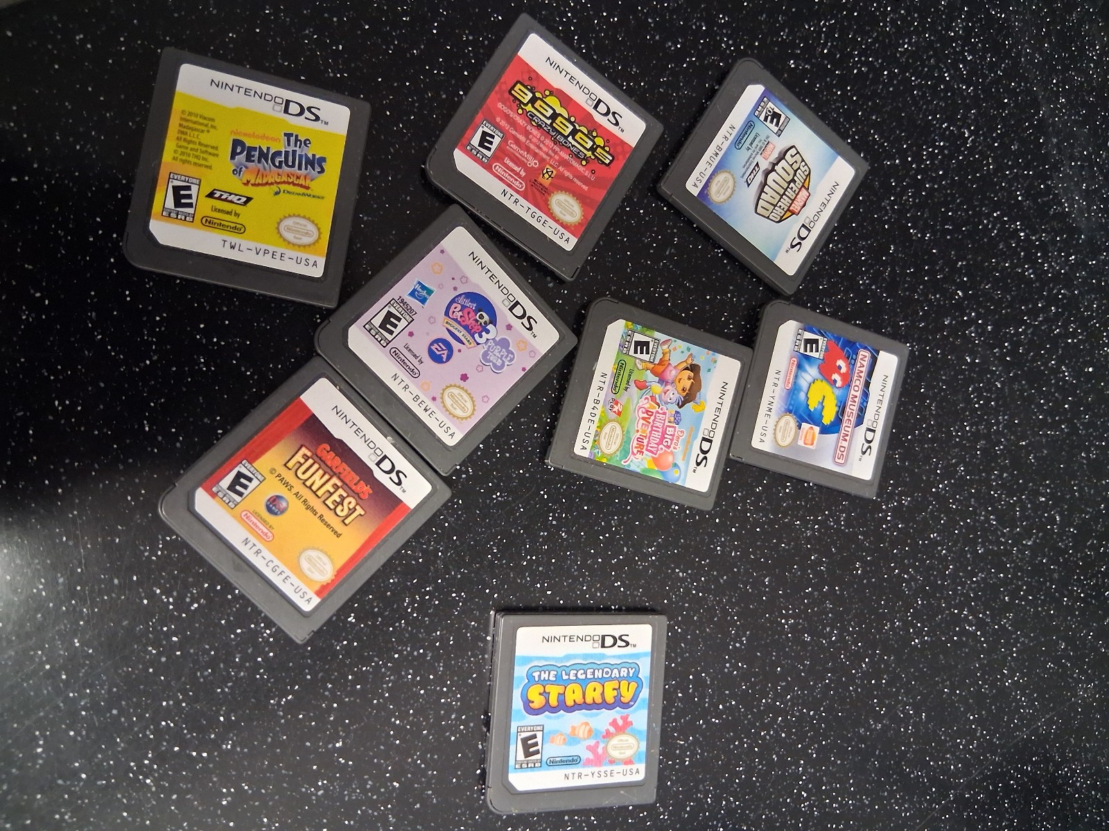 Lot of 8 Nintendo Games including Marvel Squad, pac man and the Legendary Starfy