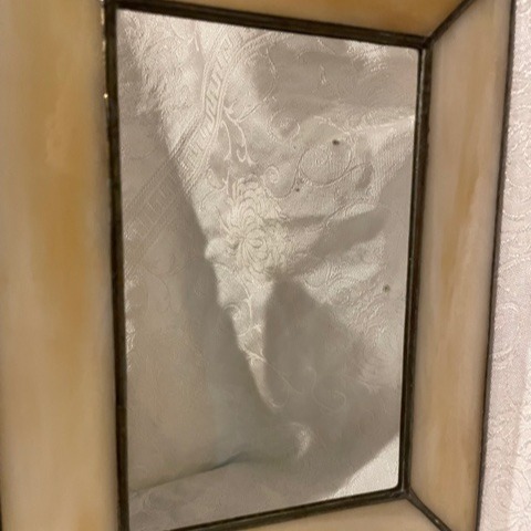 Variated ivory stained glass surrounding mirror. 7.5 X 10 for shelf or mantle