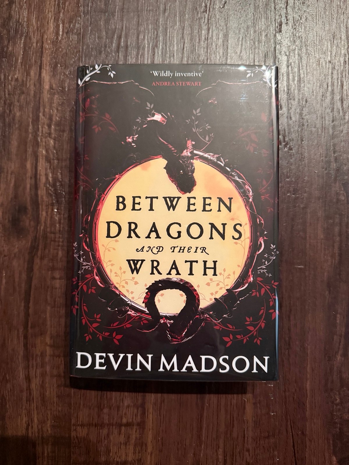 Between Dragons and Their Wrath - Devin Madson signed numbered #88